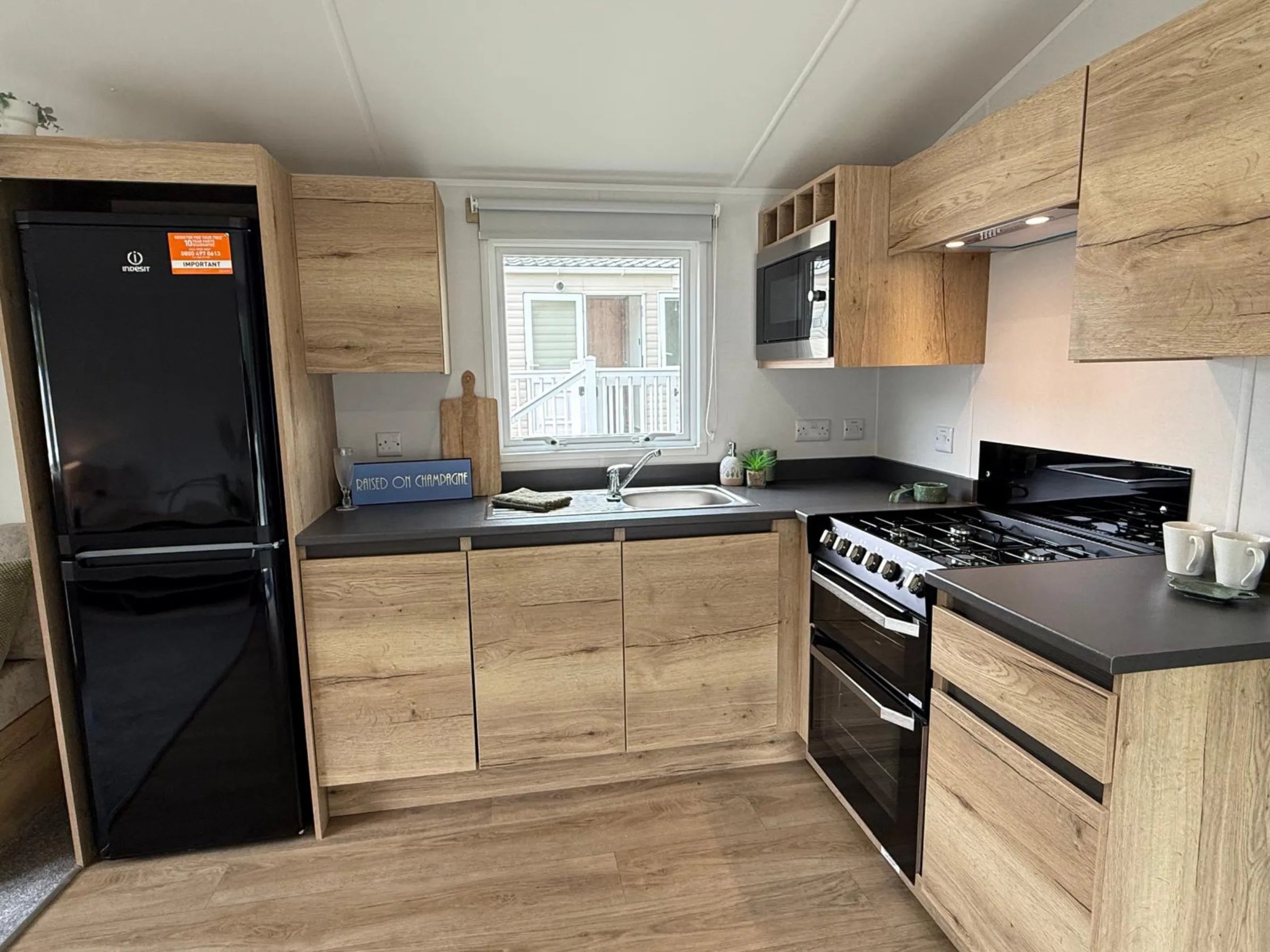 Fully equipped modern kitchen in the Midhurst self-catering holiday caravan