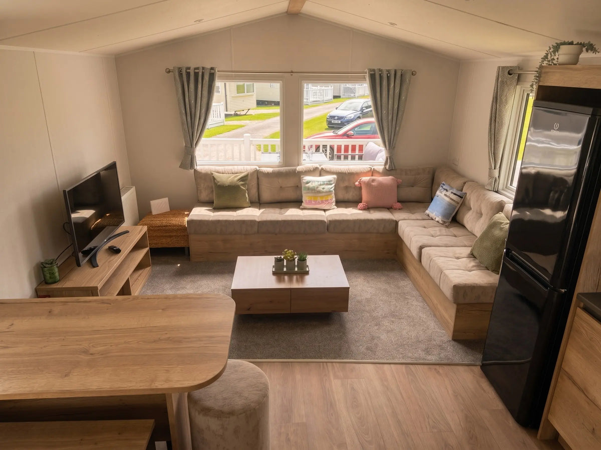 Bright open-plan living room inside the Willerby Midhurst holiday caravan