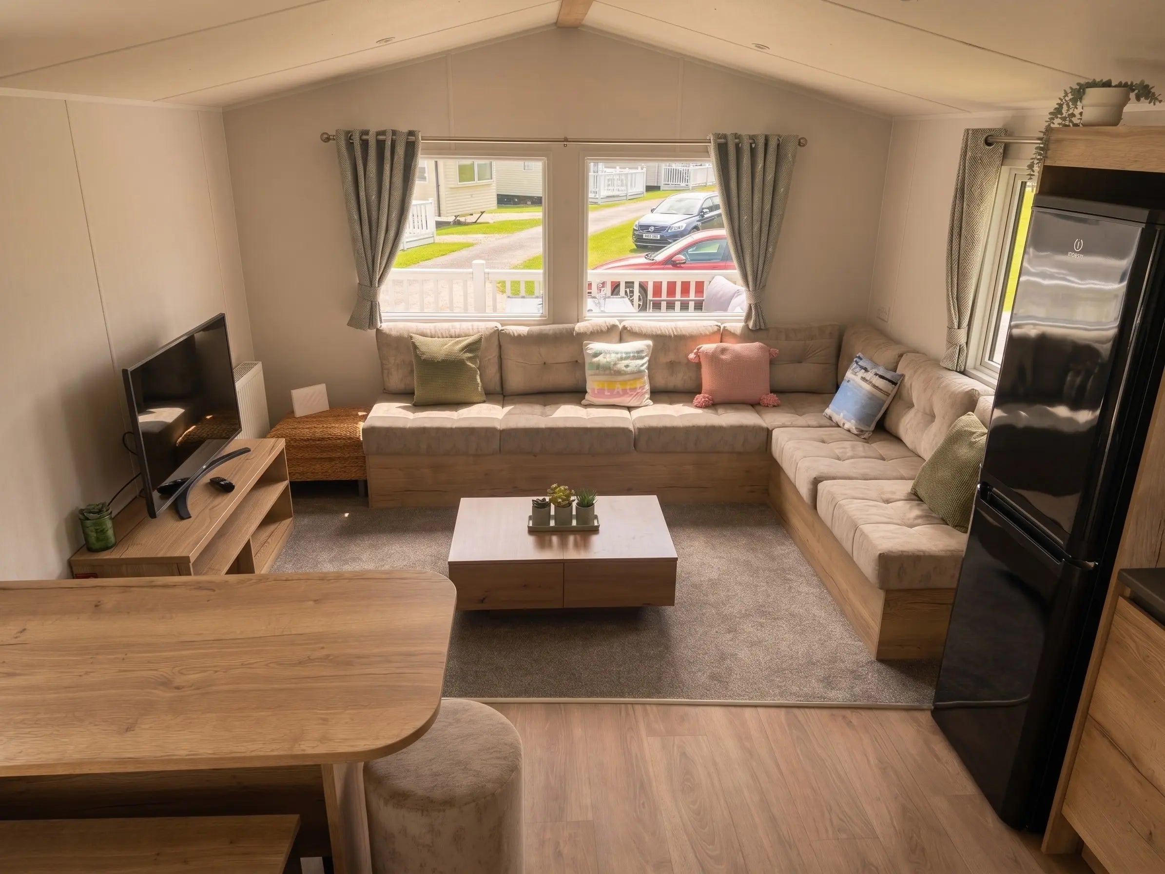 Bright open-plan living room inside the Willerby Midhurst holiday caravan